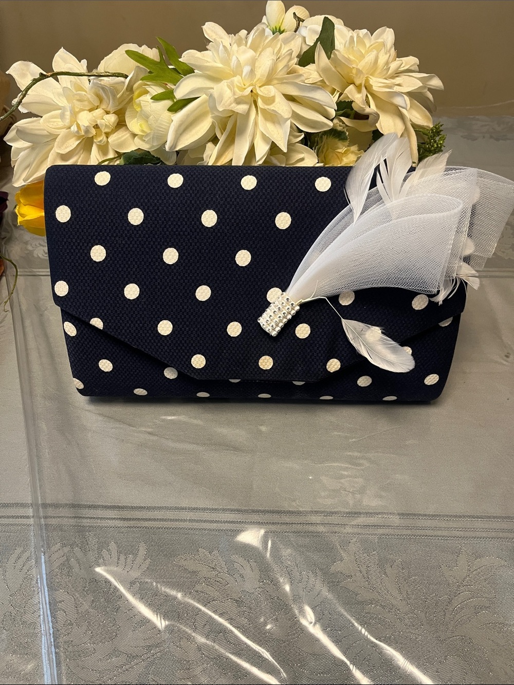Ladies Navy Blue polkadot clutch and shoulder bag with a long string